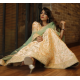 A Pastel Peach Embroidered Lehenga Set with English Elms Green Net Dupatta