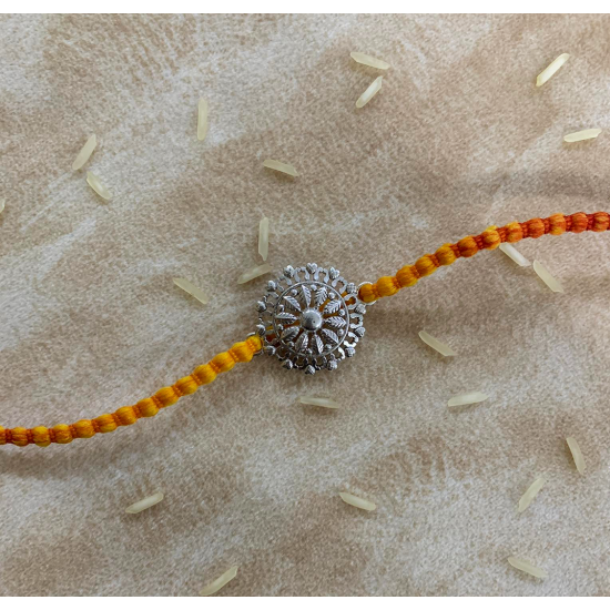 A Silver Sphere Floral Rakhi For Rakshabandhan; Rakhi For Brother
