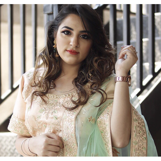 A Pastel Peach Embroidered Lehenga Set with English Elms Green Net Dupatta